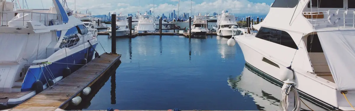 white boat on dock during daytime