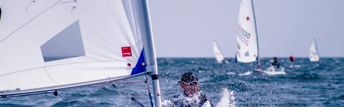 man riding sailboat